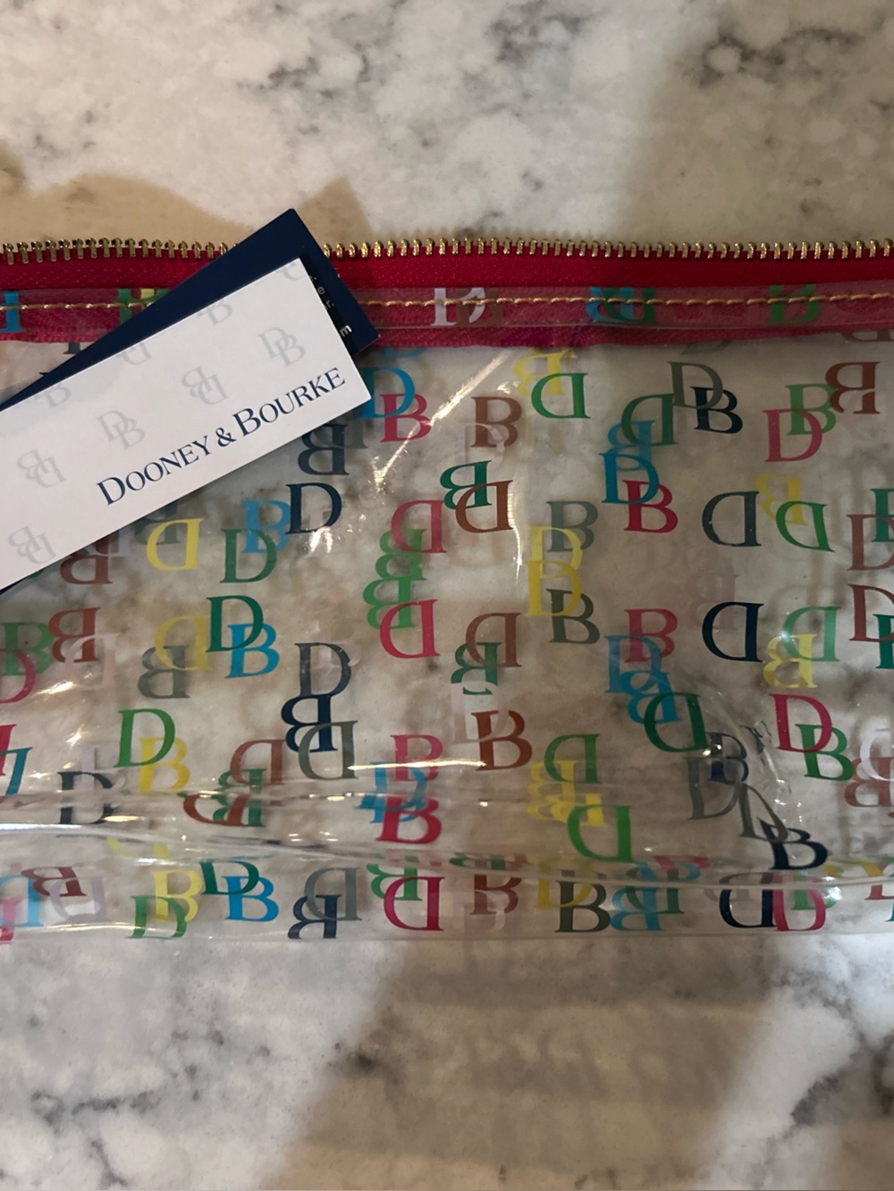 Dooney & Bourke Clear Cosmetic Pouch with Multicolor DB Print and Pink Trim